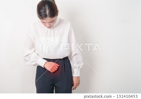 Business woman having Bladder pain for concepts of Bladder disease, Cancer Awareness Month May, Cystitis, Bladder Stone, urinary tract infection, UTI, Urethritis, Pyelonephritis, Urinary incontinence 131410453