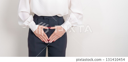 Woman hand heart shape over abdomen. Ovarian and Cervical cancer, Endometriosis, Hysterectomy, Uterine fibroids, Reproductive, menstruation, Stomach, Pregnancy and Sexual Transmitted disease concept Woman hand heart shape over abdomen. Ovarian and Cervical cancer, Endometriosis, Hysterectomy, Uterine fibroids, Reproductive, menstruation, Stomach, Pregnancy and Sexual Transmitted disease concept 131410454