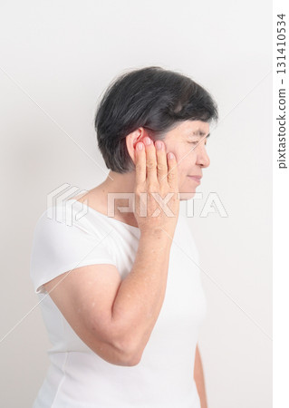 Elderly Woman having Ear pain for concept of Ear disease, Atresia, Otitis Media, Infection, Pertorated Eardrum, Meniere syndrome, Otolaryngologist, Hearing Loss, Hyperacusis, Tinnitus and Earwax Elderly Woman having Ear pain for concept of Ear disease, Atresia, Otitis Media, Infection, Pertorated Eardrum, Meniere syndrome, Otolaryngologist, Hearing Loss, Hyperacusis, Tinnitus and Earwax 131410534