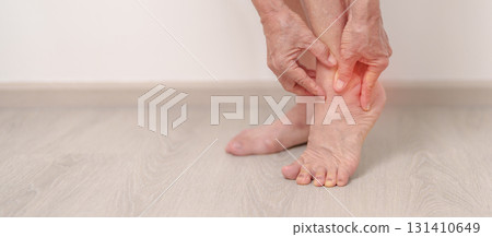 Elderly woman having leg pain due to Ankle Sprains or Achilles Tendonitis and Shin Splints ache. injury, hyperuricemia disease, Gout,Senior Health care and medical treatment  concepts 131410649