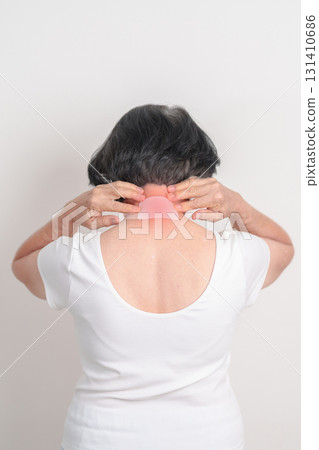 Elderly Woman having Neck pain with Medicated pain relief patch plaster for Neck Muscle Strain and Inflammation, Myofascial pain syndrome and Fibromyalgia, Rheumatism and Cervical Spine Spondylosis 131410686