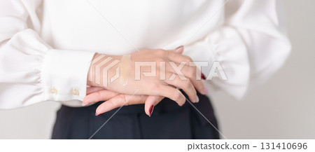 Woman having wrist pain with Medicated pain relief patch plaster for Carpal Tunnel Syndrome, Wrist Tendinitis ache, De Quervain s tenosynovitis, ergonomic, Hand Osteoarthritis and Office syndrome 131410696