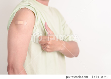 Adult Man with bandage after received vaccine. Vaccination and Immunization for Influenza, HPV, Zoster, IPD, DTP or Diphtheria, Tetanus and Pertussis, MMR, Hepatitis B, Covid and Varicella vaccine Adult Man with bandage after received vaccine. Vaccination and Immunization for Influenza, HPV, Zoster, IPD, DTP or Diphtheria, Tetanus and Pertussis, MMR, Hepatitis B, Covid and Varicella vaccine 131410930