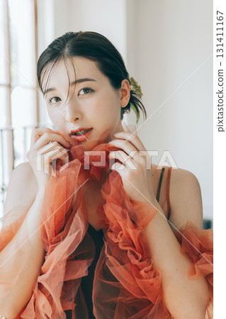 Woman wearing a dress and makeup 131411167
