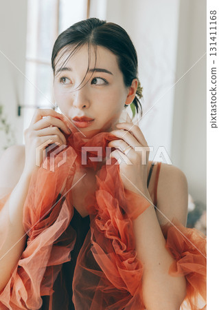 Woman wearing a dress and makeup 131411168