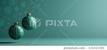 Two green ornament balls with snowflakes on teal background 131411393