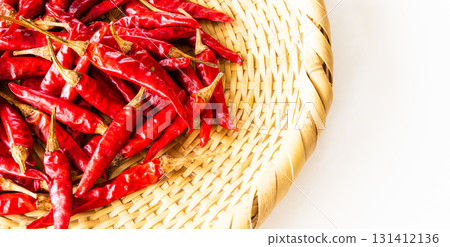 Red peppers harvested in autumn in a colander Red peppers harvested in autumn in a colander 131412136