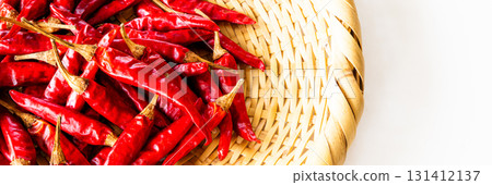 Red peppers harvested in autumn in a colander Red peppers harvested in autumn in a colander 131412137