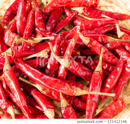 Red peppers harvested in autumn in a colander 131412146