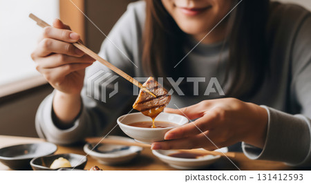 Portrait of a woman enjoying yakiniku and a meal scene Portrait of a woman enjoying yakiniku and a meal scene 131412593