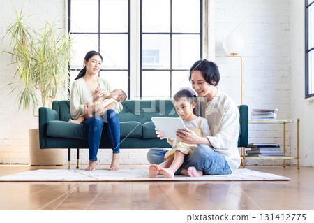 A family relaxing in the living room 131412775