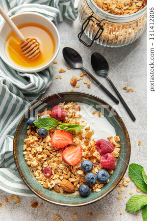 Granola bowl with yogurt and fresh berries Granola bowl with yogurt and fresh berries 131412806