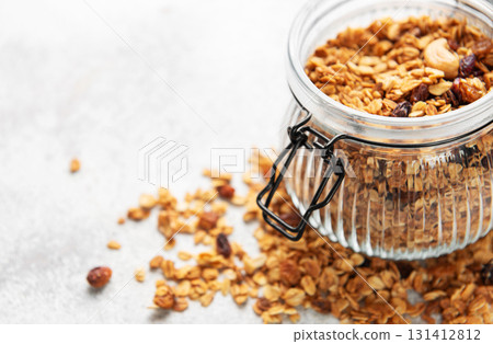 Granola cereal in glass jar for healthy breakfast 131412812