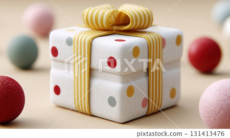 Beautifully wrapped gift box with polka dot pattern and yellow ribbon 131413476