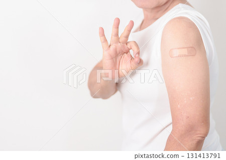 Elderly Woman with bandage after received vaccine. Vaccination and Immunization for Influenza, Herpes Zoster, Tetanus, Covid 19 booster, Dengue, Encephalitis, Rabies, Pneumococcal, IPD, RSV Vaccines Elderly Woman with bandage after received vaccine. Vaccination and Immunization for Influenza, Herpes Zoster, Tetanus, Covid 19 booster, Dengue, Encephalitis, Rabies, Pneumococcal, IPD, RSV Vaccines 131413791