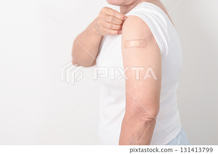 Elderly Woman with bandage after received vaccine. Vaccination and Immunization for Influenza, Herpes Zoster, Tetanus, Covid 19 booster, Dengue, Encephalitis, Rabies, Pneumococcal, IPD, RSV Vaccines Elderly Woman with bandage after received vaccine. Vaccination and Immunization for Influenza, Herpes Zoster, Tetanus, Covid 19 booster, Dengue, Encephalitis, Rabies, Pneumococcal, IPD, RSV Vaccines 131413799