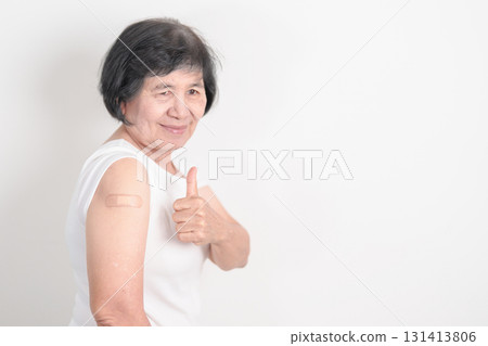 Elderly Woman with bandage after received vaccine. Vaccination and Immunization for Influenza, Herpes Zoster, Tetanus, Covid 19 booster, Dengue, Encephalitis, Rabies, Pneumococcal, IPD, RSV Vaccines Elderly Woman with bandage after received vaccine. Vaccination and Immunization for Influenza, Herpes Zoster, Tetanus, Covid 19 booster, Dengue, Encephalitis, Rabies, Pneumococcal, IPD, RSV Vaccines 131413806