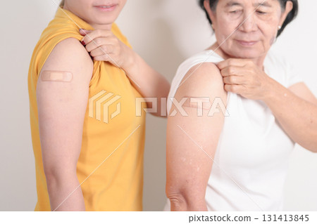 Adult and Elderly Woman with bandage after received vaccine. Vaccination and Immunization for Influenza, HPV, Zoster, IPD, DTP, Dengue, Encephalitis, Rabies, Pneumococcal Hepatitis B and Covid vaccine Adult and Elderly Woman with bandage after received vaccine. Vaccination and Immunization for Influenza, HPV, Zoster, IPD, DTP, Dengue, Encephalitis, Rabies, Pneumococcal Hepatitis B and Covid vaccine 131413845