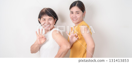 Adult and Elderly Woman with bandage after received vaccine. Vaccination and Immunization for Influenza, HPV, Zoster, IPD, DTP, Dengue, Encephalitis, Rabies, Pneumococcal Hepatitis B and Covid vaccine Adult and Elderly Woman with bandage after received vaccine. Vaccination and Immunization for Influenza, HPV, Zoster, IPD, DTP, Dengue, Encephalitis, Rabies, Pneumococcal Hepatitis B and Covid vaccine 131413853