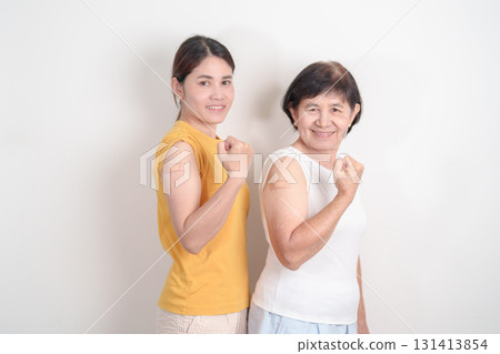 Adult and Elderly Woman with bandage after received vaccine. Vaccination and Immunization for Influenza, HPV, Zoster, IPD, DTP, Dengue, Encephalitis, Rabies, Pneumococcal Hepatitis B and Covid vaccine Adult and Elderly Woman with bandage after received vaccine. Vaccination and Immunization for Influenza, HPV, Zoster, IPD, DTP, Dengue, Encephalitis, Rabies, Pneumococcal Hepatitis B and Covid vaccine 131413854