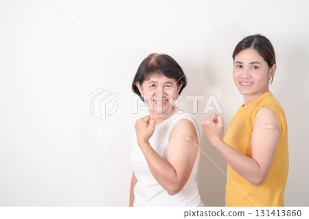 Adult and Elderly Woman with bandage after received vaccine. Vaccination and Immunization for Influenza, HPV, Zoster, IPD, DTP, Dengue, Encephalitis, Rabies, Pneumococcal Hepatitis B and Covid vaccine Adult and Elderly Woman with bandage after received vaccine. Vaccination and Immunization for Influenza, HPV, Zoster, IPD, DTP, Dengue, Encephalitis, Rabies, Pneumococcal Hepatitis B and Covid vaccine 131413860