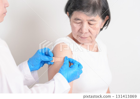 Elderly Woman with bandage after received vaccine. Vaccination and Immunization for Influenza, Herpes Zoster, Tetanus, Covid 19 booster, Dengue, Encephalitis, Rabies, Pneumococcal, IPD, RSV Vaccines Elderly Woman with bandage after received vaccine. Vaccination and Immunization for Influenza, Herpes Zoster, Tetanus, Covid 19 booster, Dengue, Encephalitis, Rabies, Pneumococcal, IPD, RSV Vaccines 131413869