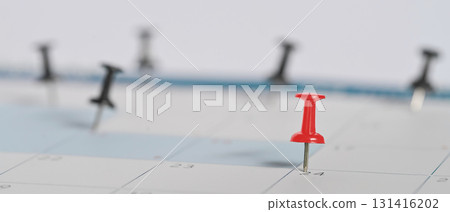 Calendar with a red push pin marking an important date, symbolizing appointment reminders Calendar with a red push pin marking an important date, symbolizing appointment reminders 131416202