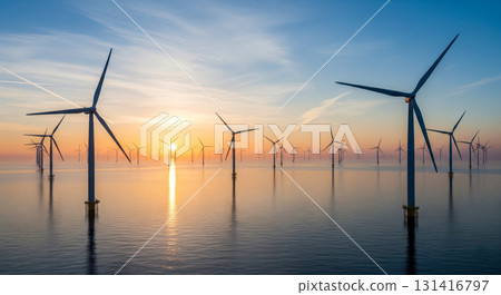 Offshore wind turbines farm in sea at sunset, renewable energy concept with windmills generating clean electricity for sustainable future and environmental conservation 131416797
