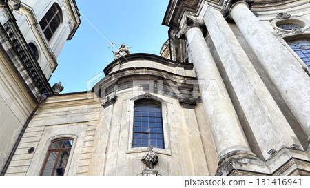 Historic baroque church and cathedral dome in central Lviv, Ukraine. Ancient architecture and religious landmark on Market Square 131416941