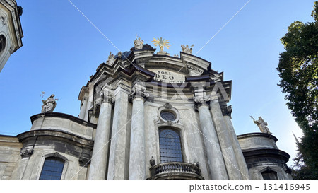 Historic baroque church and cathedral dome in central Lviv, Ukraine. Ancient architecture and religious landmark on Market Square 131416945
