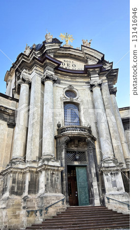 Historic baroque church and cathedral dome in central Lviv, Ukraine. Ancient architecture and religious landmark on Market Square 131416946