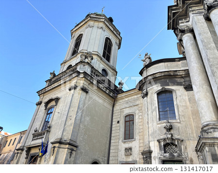 Historic baroque church and cathedral dome in central Lviv, Ukraine. Ancient architecture and religious landmark on Market Square 131417017