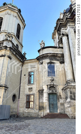 Historic baroque church and cathedral dome in central Lviv, Ukraine. Ancient architecture and religious landmark on Market Square 131417018
