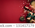 Two gift boxes and Christmas ornaments on red background. Boxing day, Christmas and New Year gifts. Holiday greeting card. 131417179