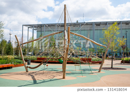 large climbing structure resembling in urban park. climbing rope object on the playground for Children play 131418034