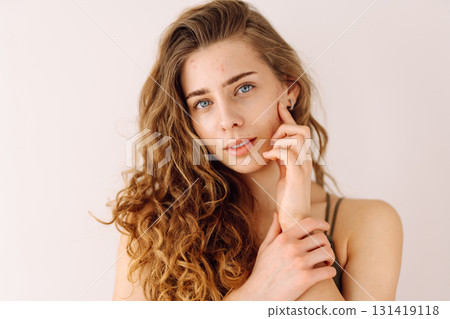 Portrait of a beautiful young woman with inflammations on the skin of her face. Acne disease. 131419118