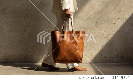 Stylish walk with a brown tote bag 131419295