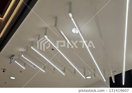 Title: Modern Linear LED Ceiling Lighting Design in Commercial Space. Title: Modern Linear LED Ceiling Lighting Design in Commercial Space. 131419607