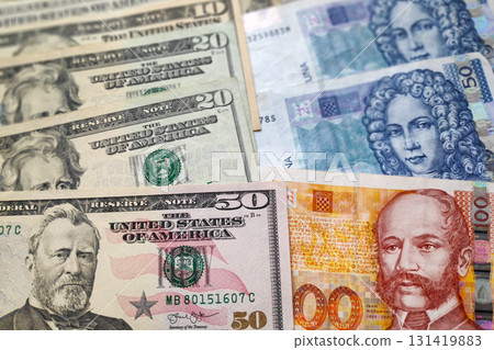 Stack of US Dollars and Croatian Kuna Stack of US Dollars and Croatian Kuna 131419883