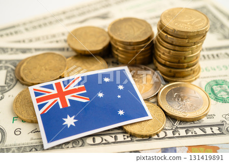 Stack of coins with Australia flag and US dollar banknotes. Stack of coins with Australia flag and US dollar banknotes. 131419891