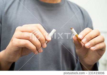 Quit smoking, Asian teenage man breaking destroy cigarette in hand. Quit smoking, Asian teenage man breaking destroy cigarette in hand. 131419896