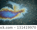 Oil spill on wet asphalt surface showing colorful iridescent abstract pattern 131419970