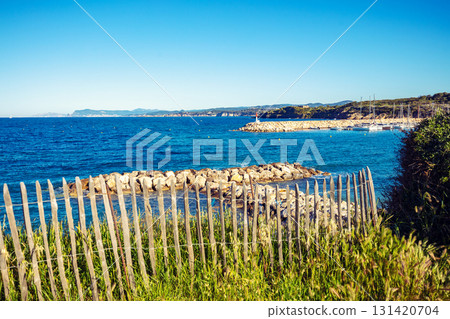 Seascape with wooden fence on a cloudy day. Coudouliere Beach (Six-Fours-les-Plages), France Europe Seascape with wooden fence on a cloudy day. Coudouliere Beach (Six-Fours-les-Plages), France Europe 131420704