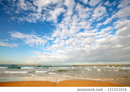 Seascape on a sunny day with a beautiful cloudy sky Seascape on a sunny day with a beautiful cloudy sky 131421016