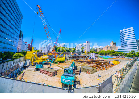 Tokyo cityscape in Japan. Overlooking the redevelopment work in front of Shinagawa Station. Large heavy machinery such as crawler cranes are lined up... (26th) 131421530