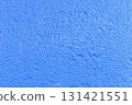 The rough texture of a dark blue wall. The harsh texture of a deep blue surface. The concept of background and textured surfaces. 131421551