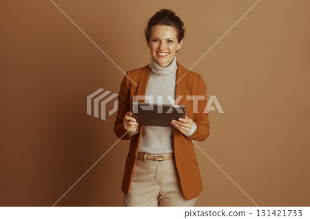 Confident Businesswoman Holding Digital Tablet 131421733