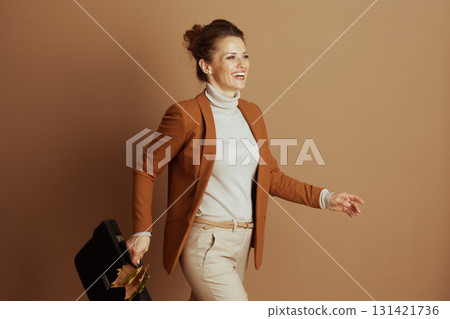 Dynamic Businesswoman on the Go in Autumn Style 131421736