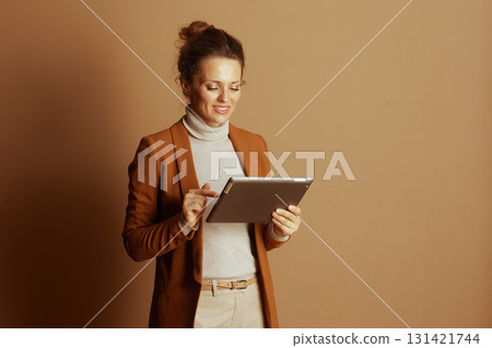 Engaged Businesswoman Pointing at Tablet Screen 131421744