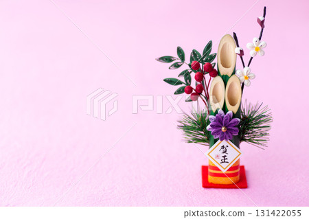 New Year's pine decoration on a pink background New Year's pine decoration on a pink background 131422055